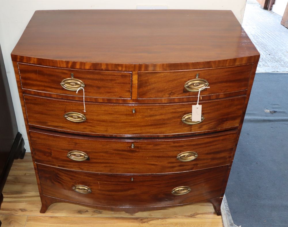 A George III inlaid mahogany bowfront chest of two short and three long drawers, W.91cm, D.52cm, H.91cm